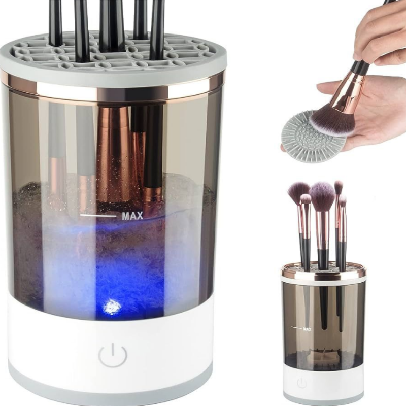 Makeup brush cleaner with brushes and a hand holding a brush above it.